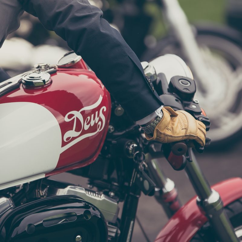 Man with gloves on a motorcycle
