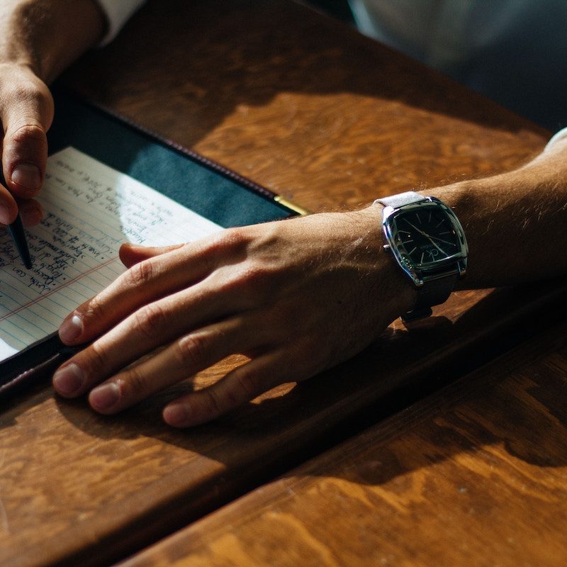 A man journaling on lined paper