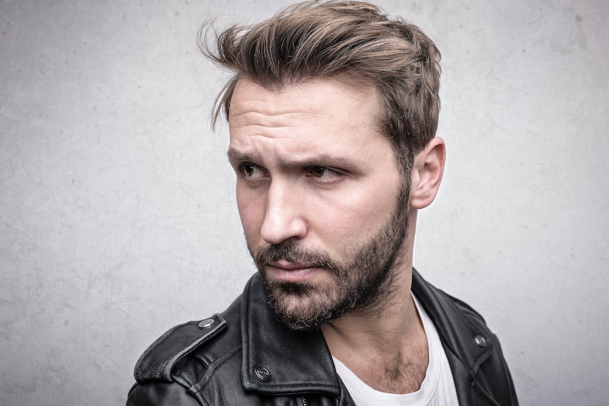man in leather jacket full head of hair