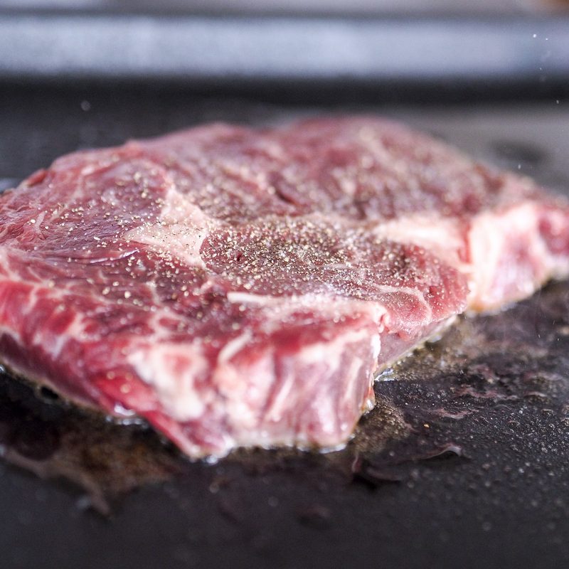 Raw steak cooking