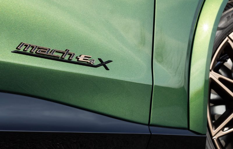 2024 Ford Mustang Mach-E Bronze detail shot of the Mach-E4 S badging on the right front passenger door.
