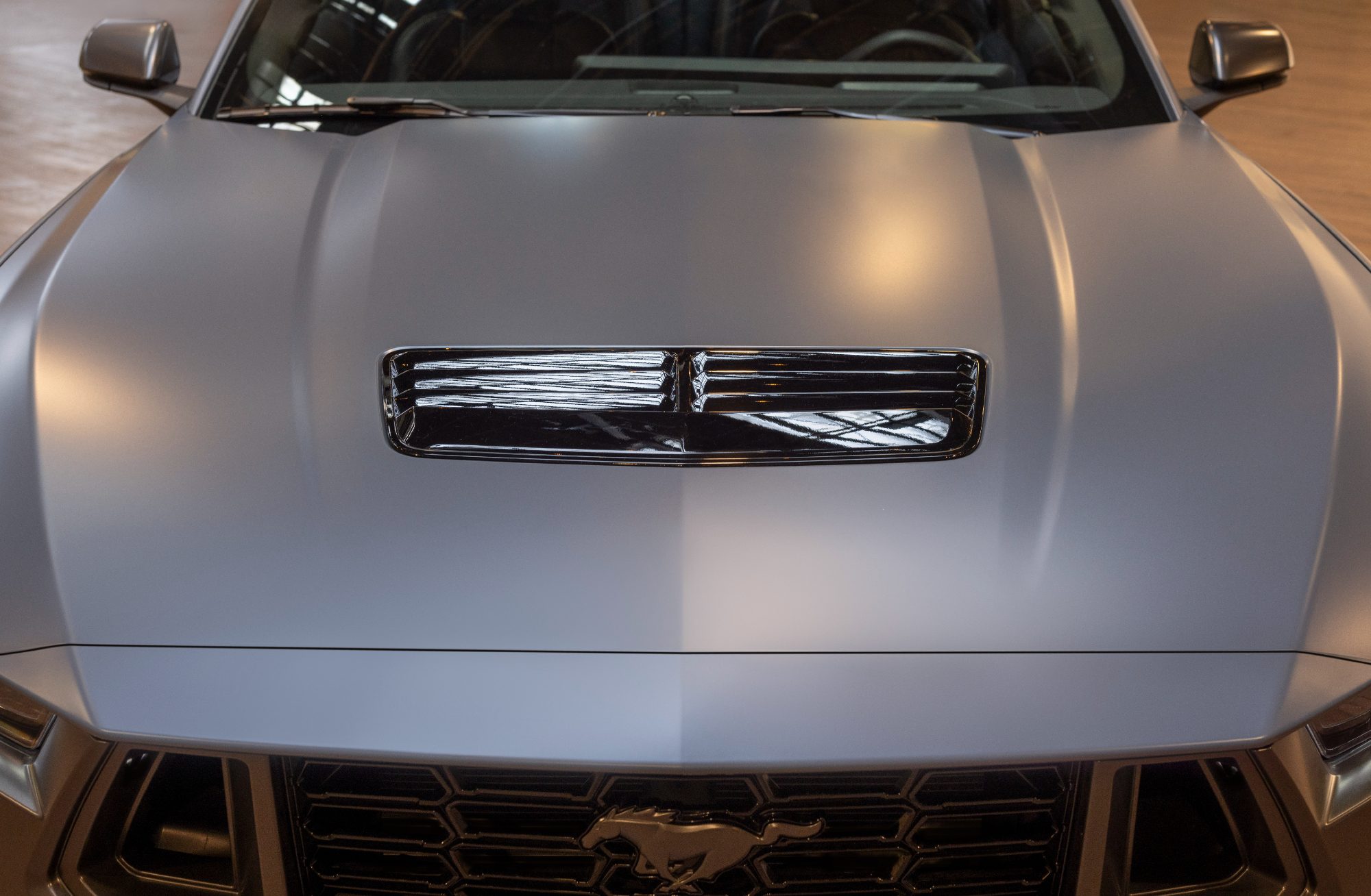 2024 Ford Mustang with Matte Clear Film direct front view of hood with chrome air intake.
