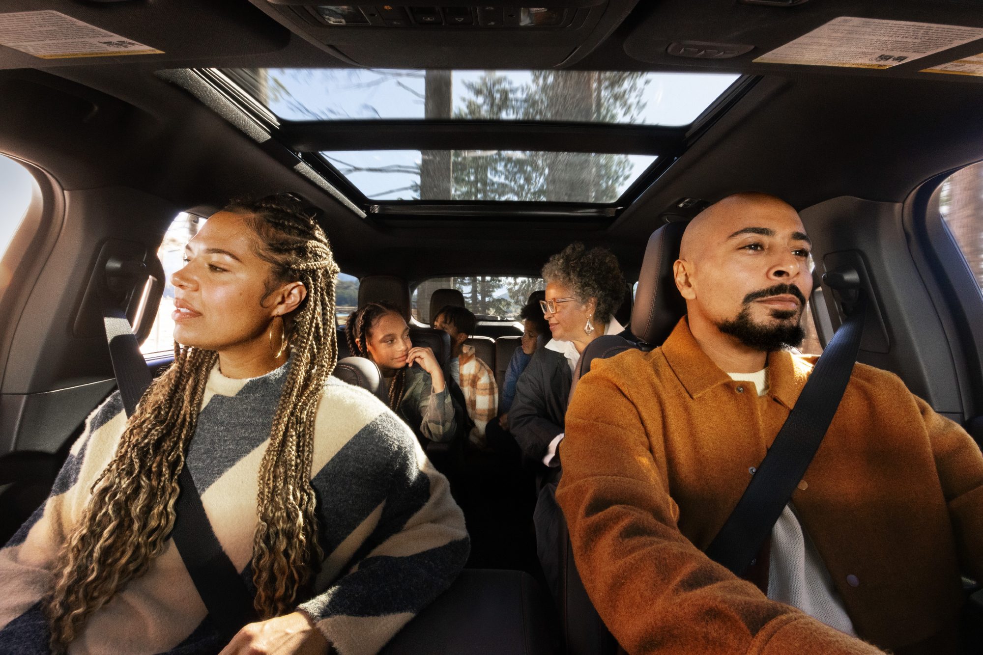 2025 Ford Explorer with three rows of passengers and a double sun-roof.