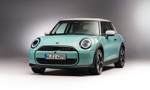 2025 Mini Cooper S left front three-quarter view studio shot with shadows.