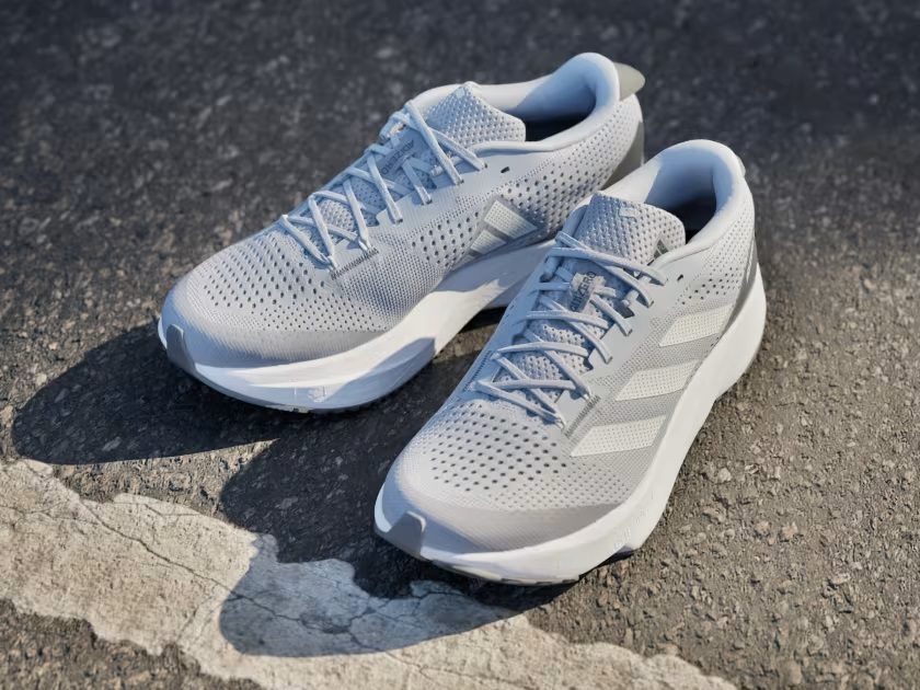 The Adidas Adizero SL on a road.