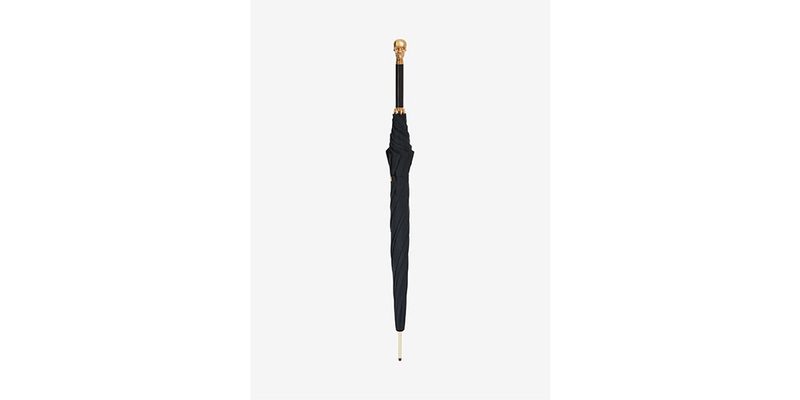 The Alexander McQueen Skull Umbrella on a white background.