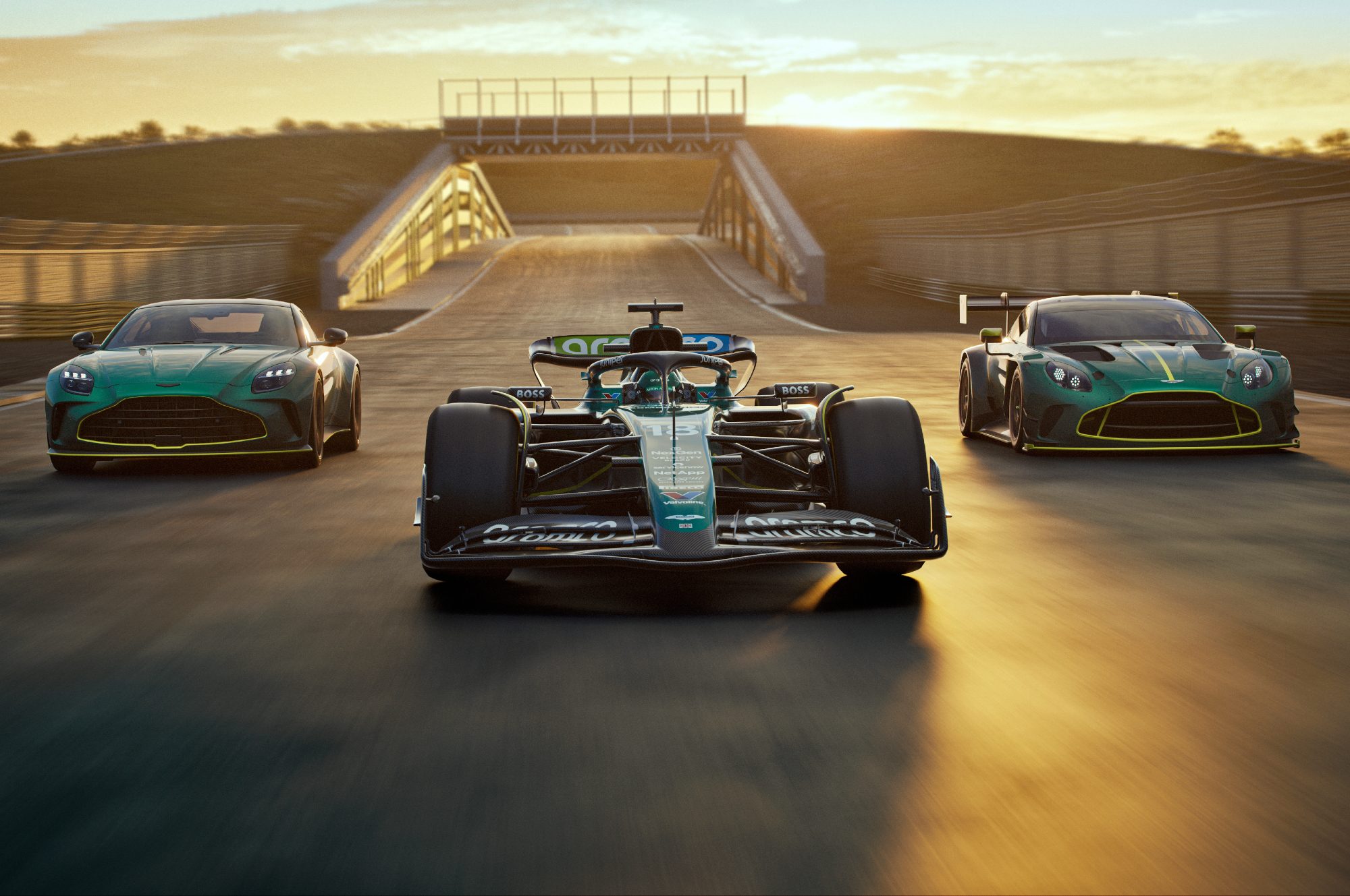 Aston Martin Vantage sports car, Aston Martin AMR24 Formula 1race care and Aston Martin Vantage GT3 racer lined up across a racetrack.
