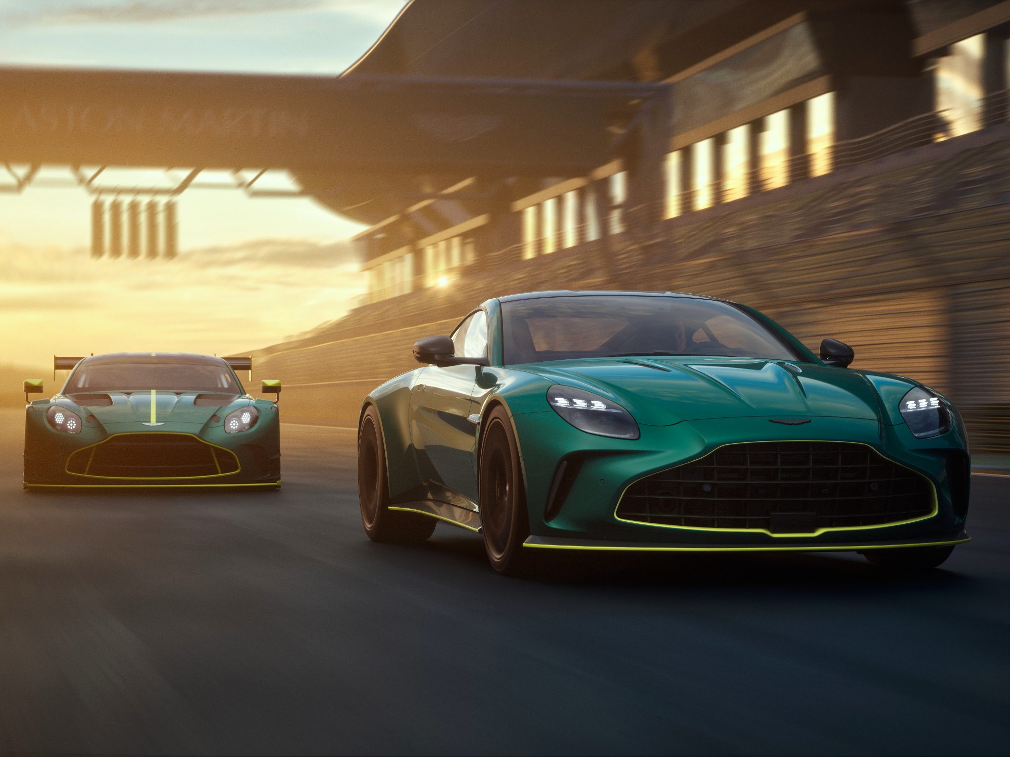 Aston Martin Vantage sports car on a track with an Aston Martin Vantage GT3 race car behind.