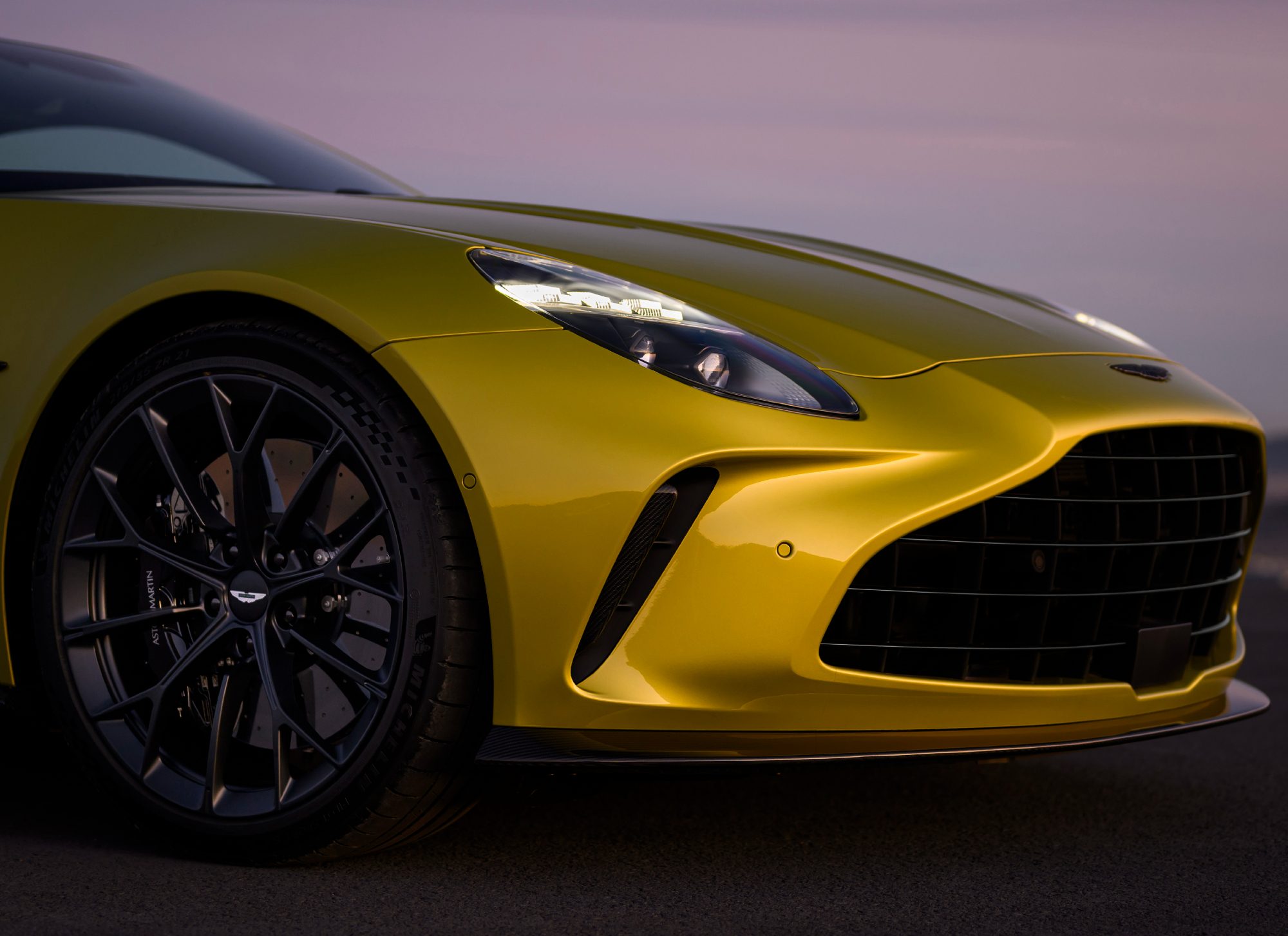 Aston Martin Vantage sports car right front wheel and nose.
