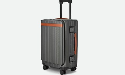 Carl Friedrik The Carry-On Pro, standing up with its handle extended.