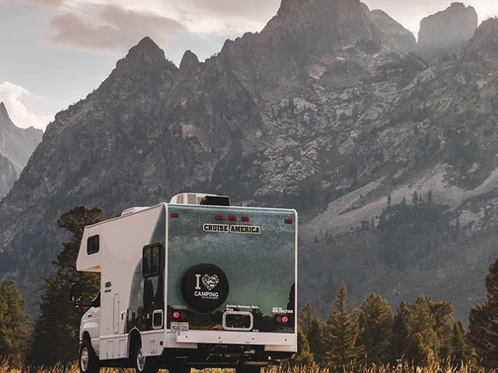 A Cruise America rental RV near some mountains.