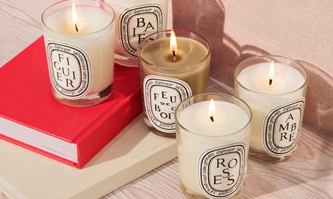 diptyque candle deals gilt february 2024 candles burning on a table