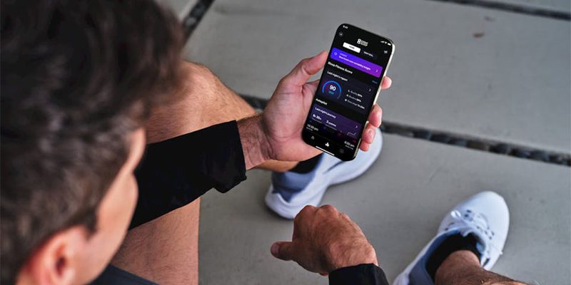 A man using the Eight Sleep Autopilot app.