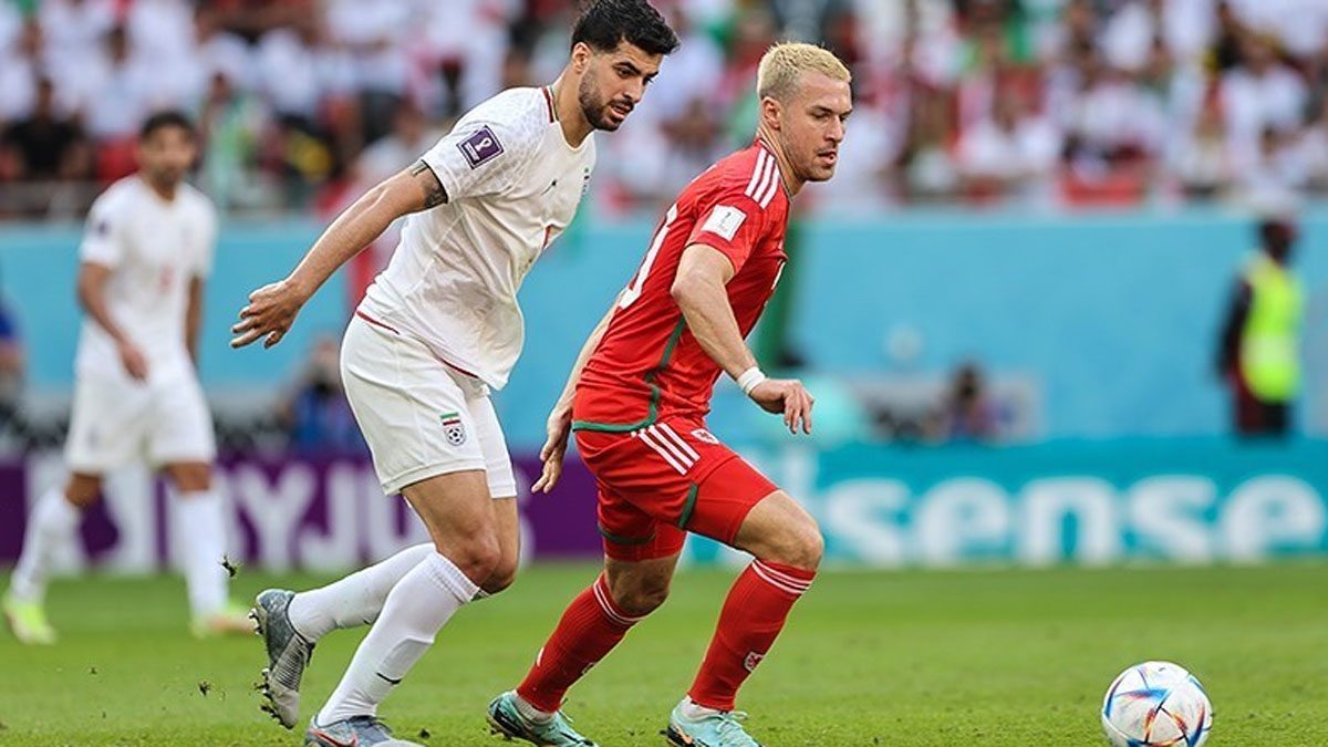 Iran's football team takes on Wales in the 2022 FIFA World Cup.