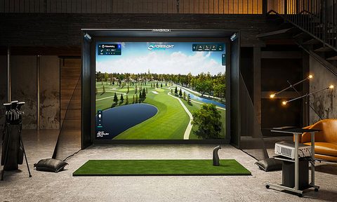 The Foresight Sports Sim-In-a-Box set up in a basement.