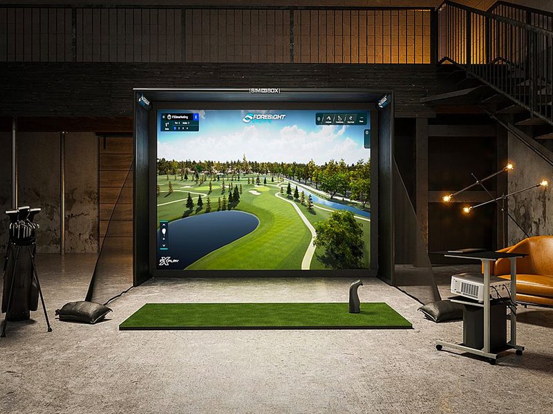 The Foresight Sports Sim-In-a-Box set up in a basement.