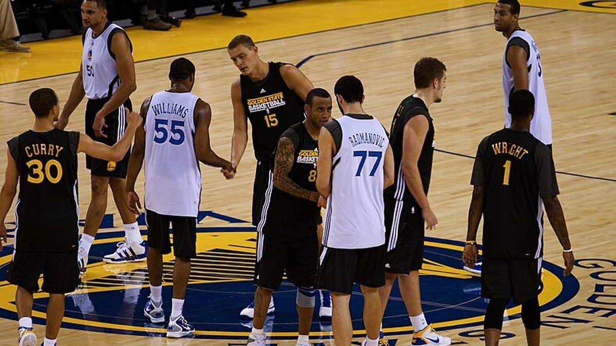 The Golden State Warriors players take the court.