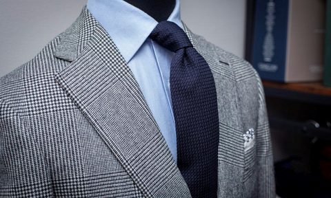 Gray sport coat on rack