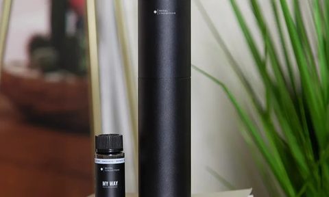 Hotel Collection Studio Pro scent diffuser with oils nearby.