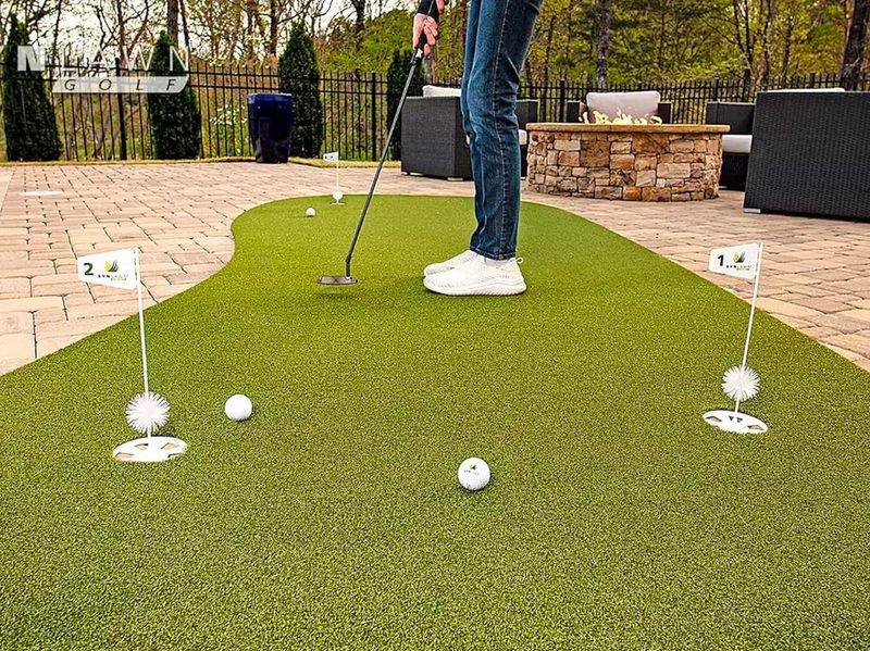 A person prepares to putt on the SynLawn Precision Putt.
