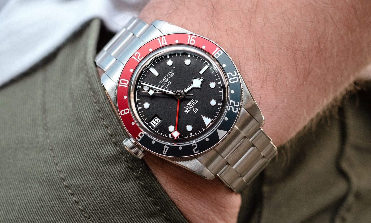 A man wearing a Tudor Black Bay GMT watch.