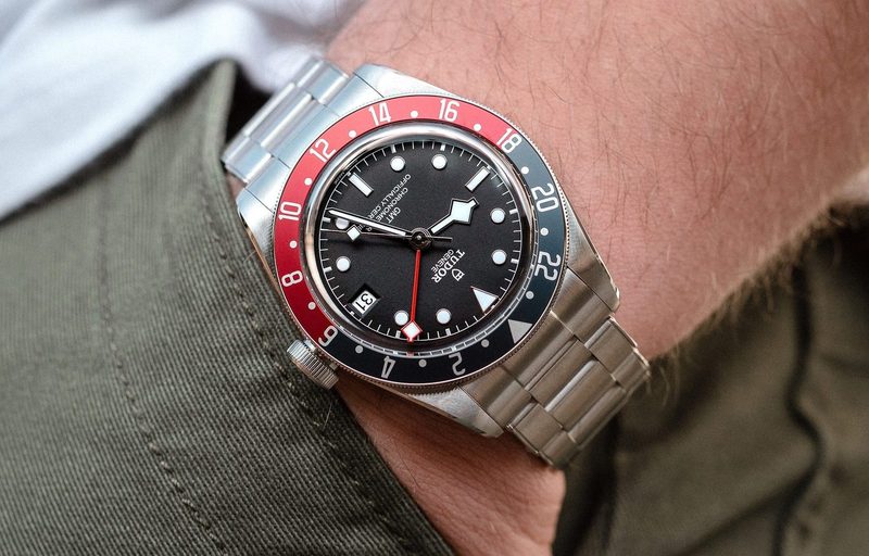 A man wearing a Tudor Black Bay GMT watch.