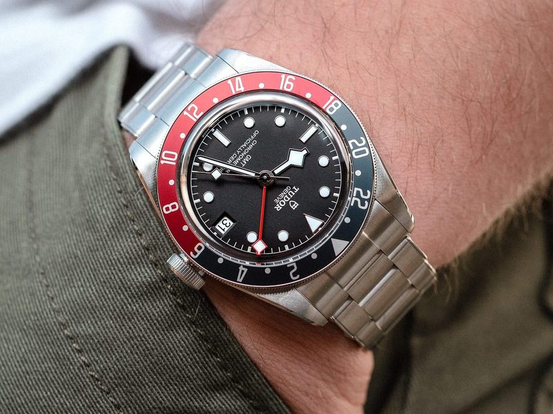 A man wearing a Tudor Black Bay GMT watch.