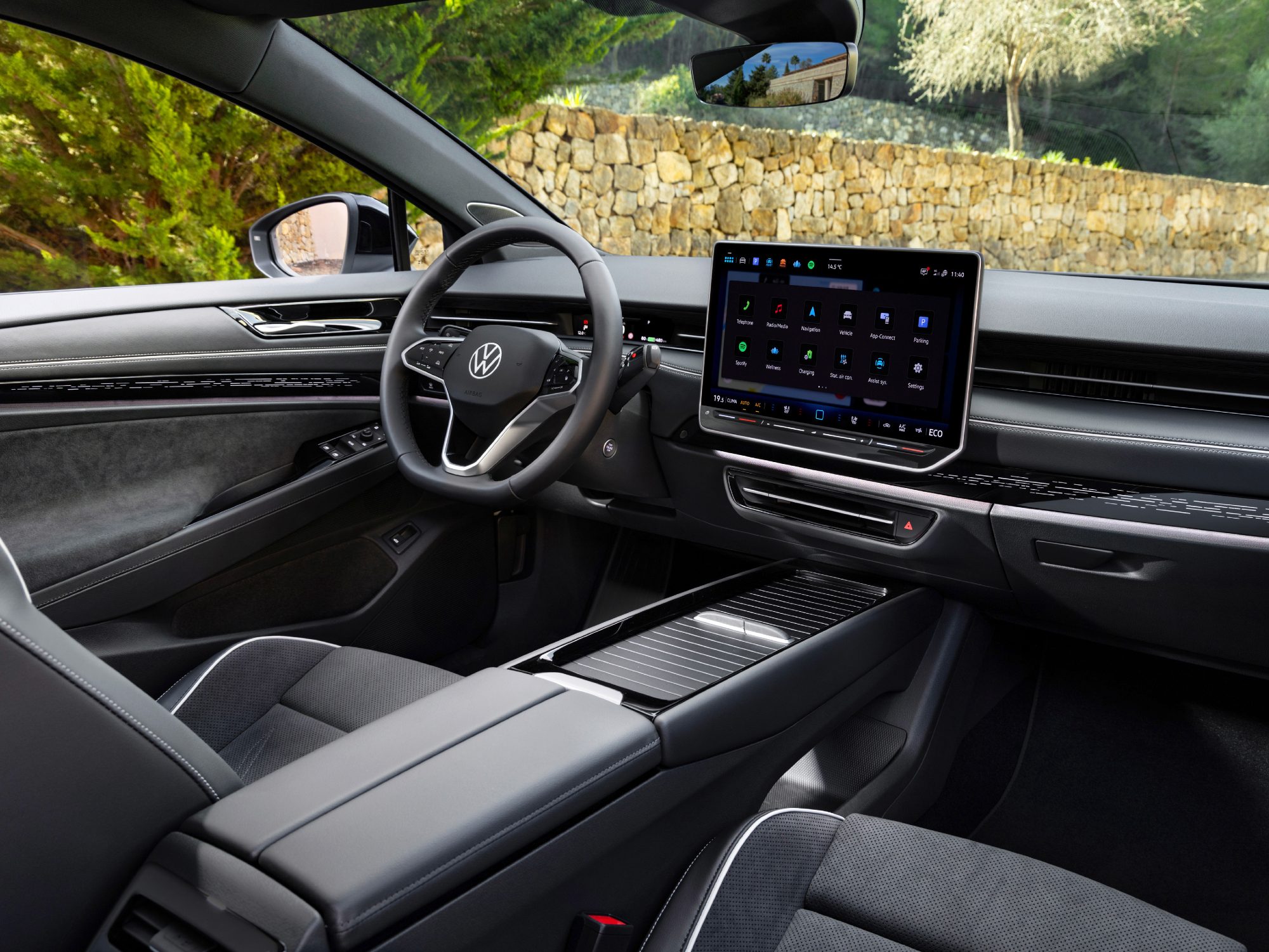 VW ID.7 concept interior view from passenger side showing cockpit, large center display, and console.