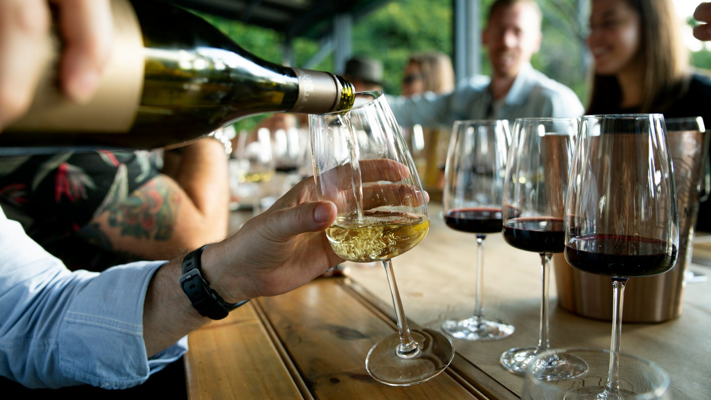 Bartender pouring wine