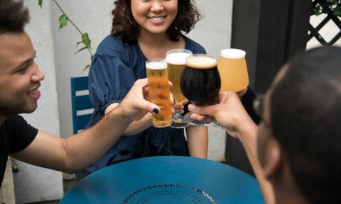 Friends toasting with beer