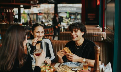 Friends sharing a meal in a restaurant
