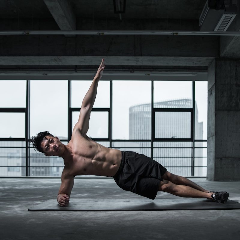 a man doing a side plank