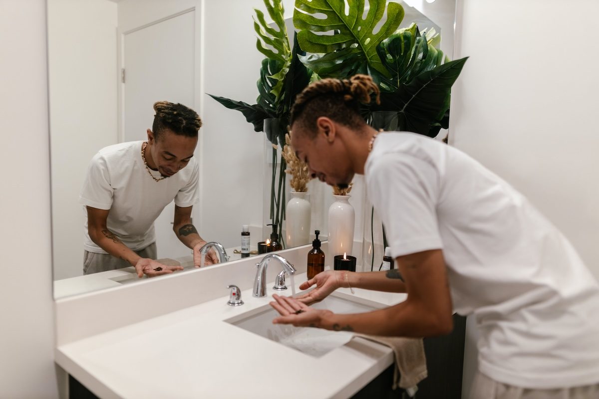 a man washing his hands