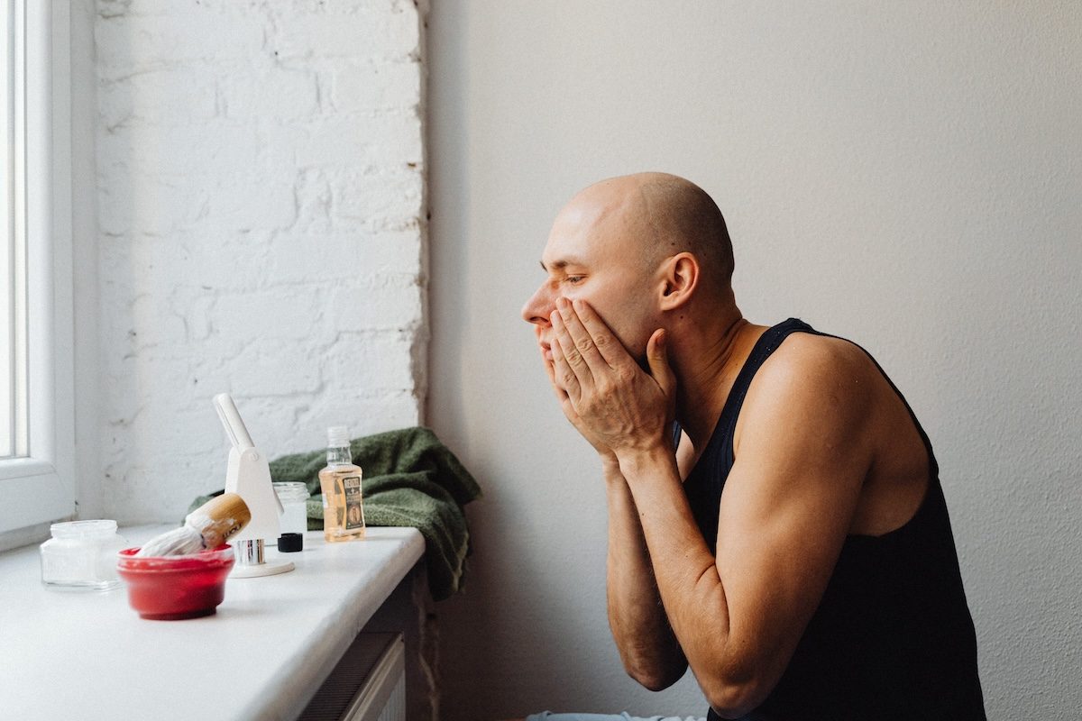 man doing skincare