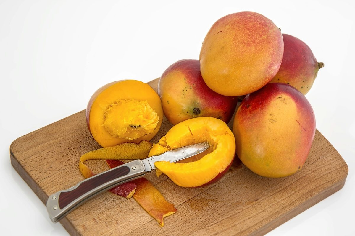 mangos on a cutting board