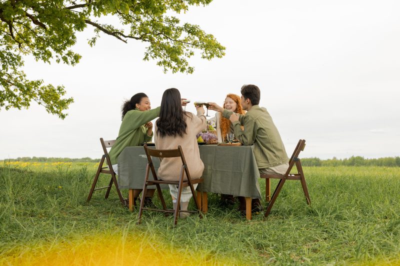 Group of people sharing a meal outside together
