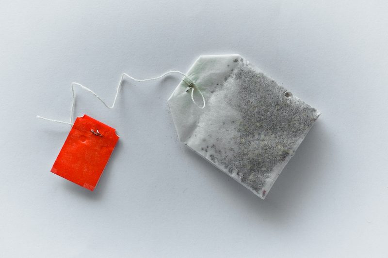 single tea bag, white background