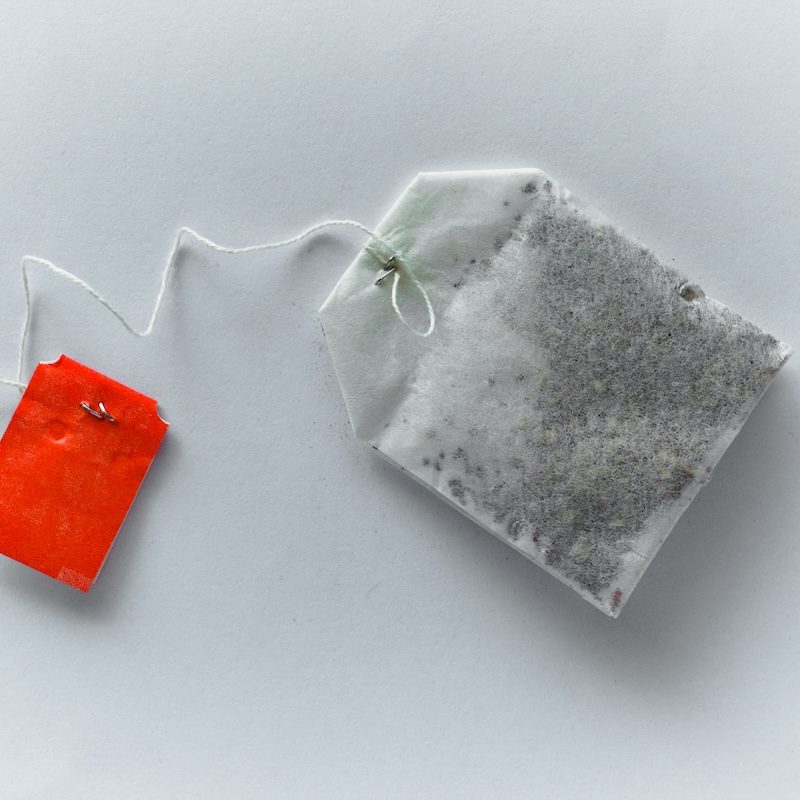 Single tea bag on a white background