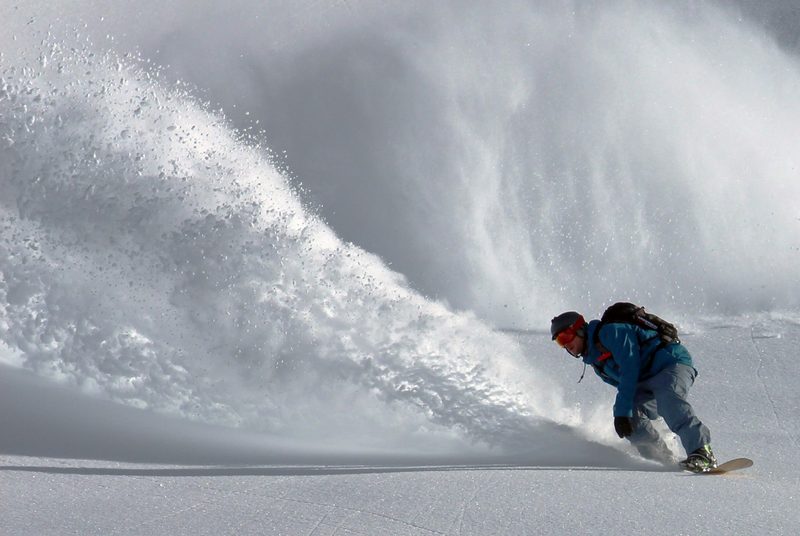 Snowboarding powder turn