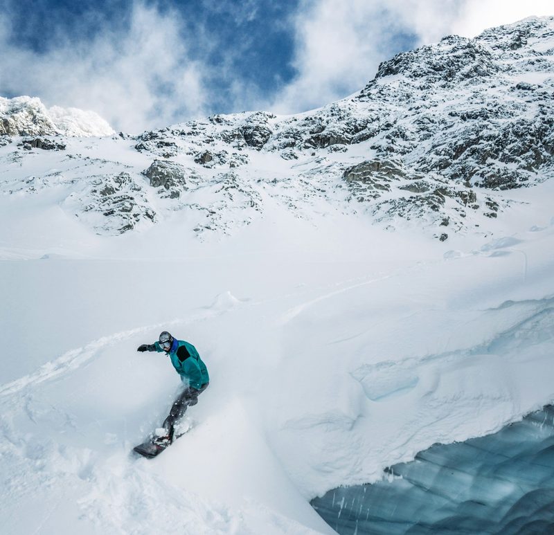 Snowboarder in Whistler big mountain terrain