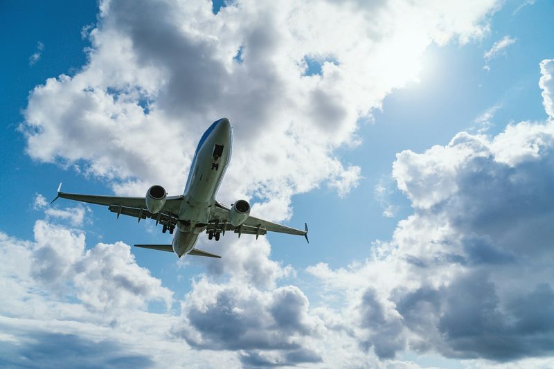 Airplane flying through the sky