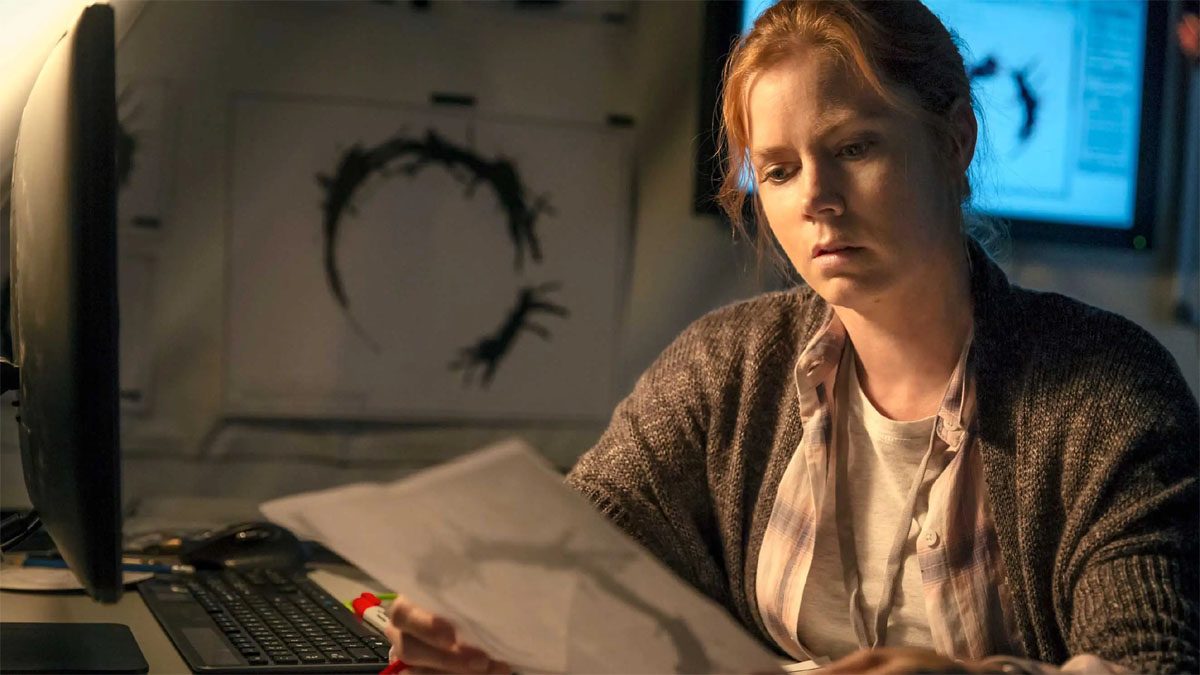 Amy Adams attempts to decipher an alien language in Arrival.