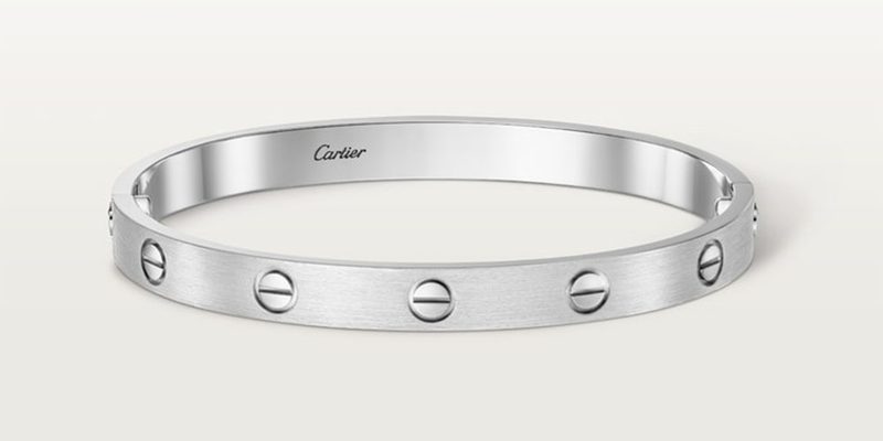 The Cartier Love bracelet on a white background.