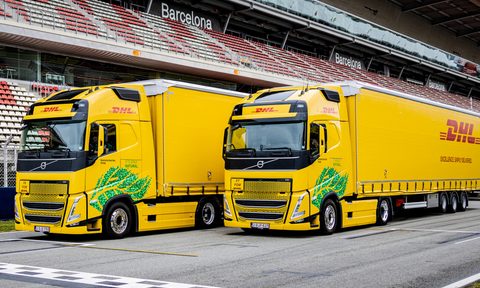 DHL Biofuel trucks deliver team equipment for F1 races in Europe.