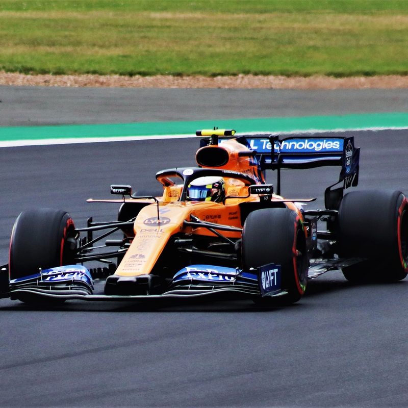 Lando Norris driving a McLaren F1 race car.