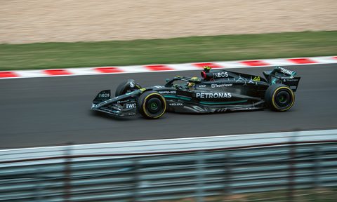 Lewis Hamilton driving a Mercedes AMG Petronas F1 race car.