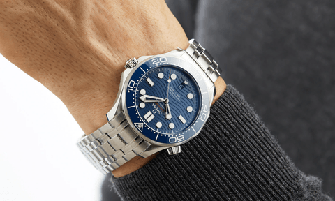 The OMEGA Seamaster Diver 300 Co Axial on a man's wrist.