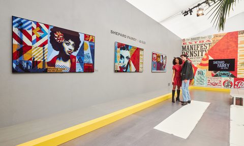 Shepard Fairey artwork X LG OLED Art on display at Frieze LA 2024 with visitors in the gallery.