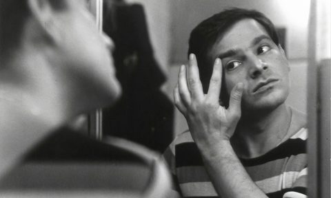 man looking in mirror