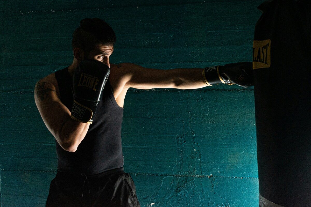 Man using punching bag.